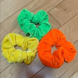 three neon velvet scrunchies